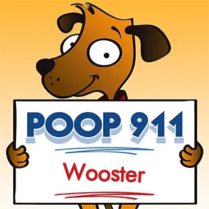 POOP 911 Wooster, Ohio yard sign being held by a Smiling Brown Dog.