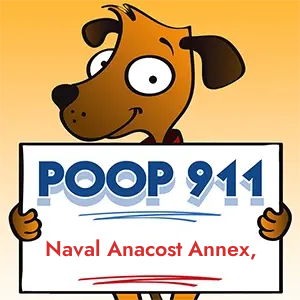 POOP 911 Naval Anacost Annex, DC yard sign being held by a Smiling Brown Dog.